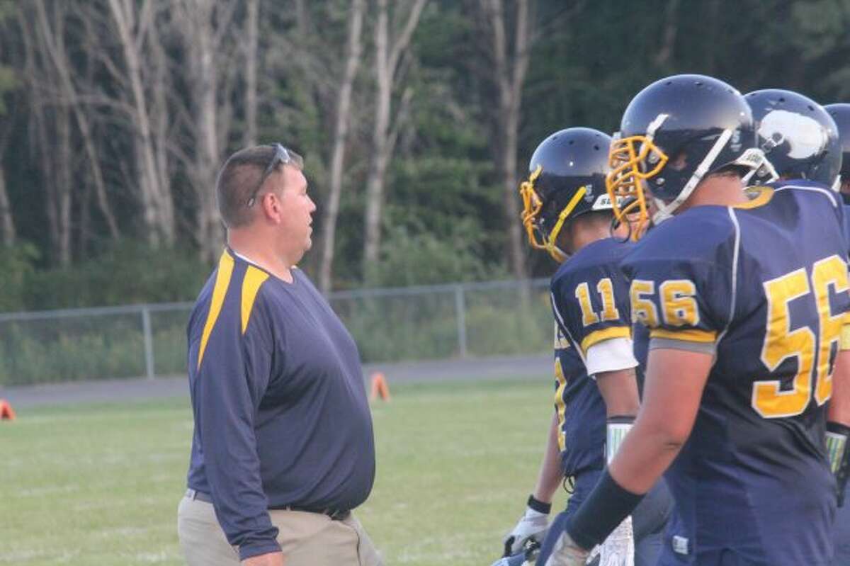 Baldwin assistant coach Scott Pedigo talks to his defense.