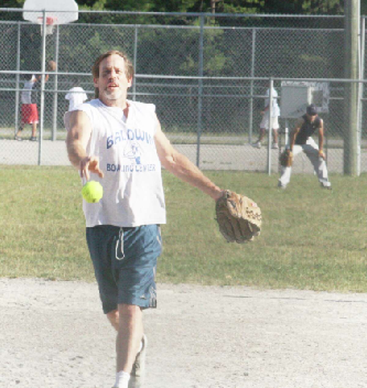 Tournament: Nick Miller makes a pitch in last year’s Baldwin Men’s Softball League. There is no league this season but Baldwin will still host the Troutarama and Labor Day tournaments. (File photo)