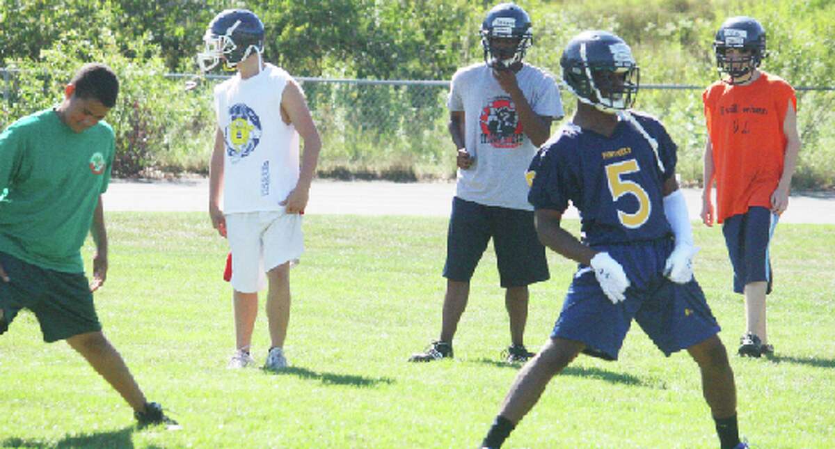 Conditioning: Baldwin football players, pictured here at the 2012 preseason practices, are now in weight-lifting and conditioning sessions, getting ready for the season. (File photo)