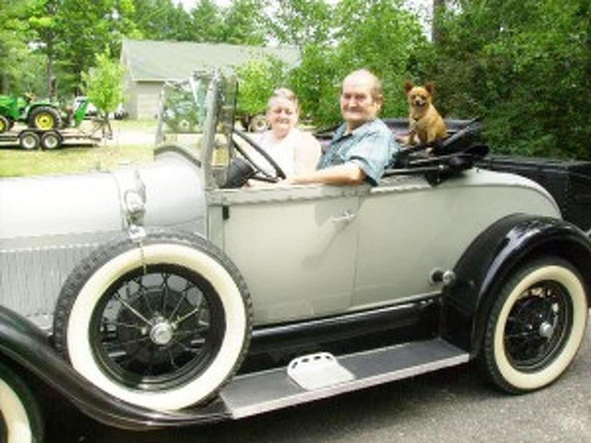 READY FOR THE PARADE: Rodger and Kathy Baker sit in their 1928 Model A Ford before joining Saturday’s parade. (Star photo/Ann Walters)