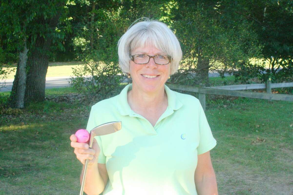 Hole in one: Janet Gillette of Baldwin is all smiles after a hole-in-one at Marquette Trails. (Star/John Raffel)