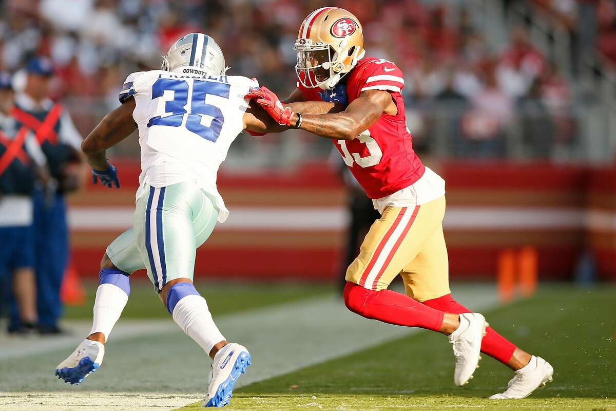 San Francisco 49ers safety Tarvarius Moore, left, and linebacker