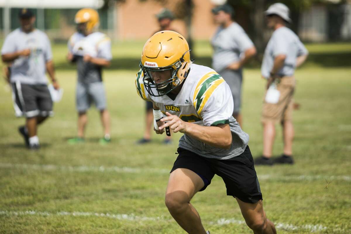 Dow High football players scrimmage during a practice on Friday, Aug. 16, 2019. (Katy Kildee/kkildee@mdn.net)
