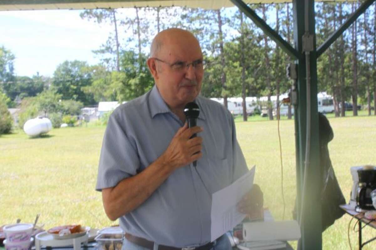 Roger Elkins, Evart resident, presented a program at the Chase area school reunion.