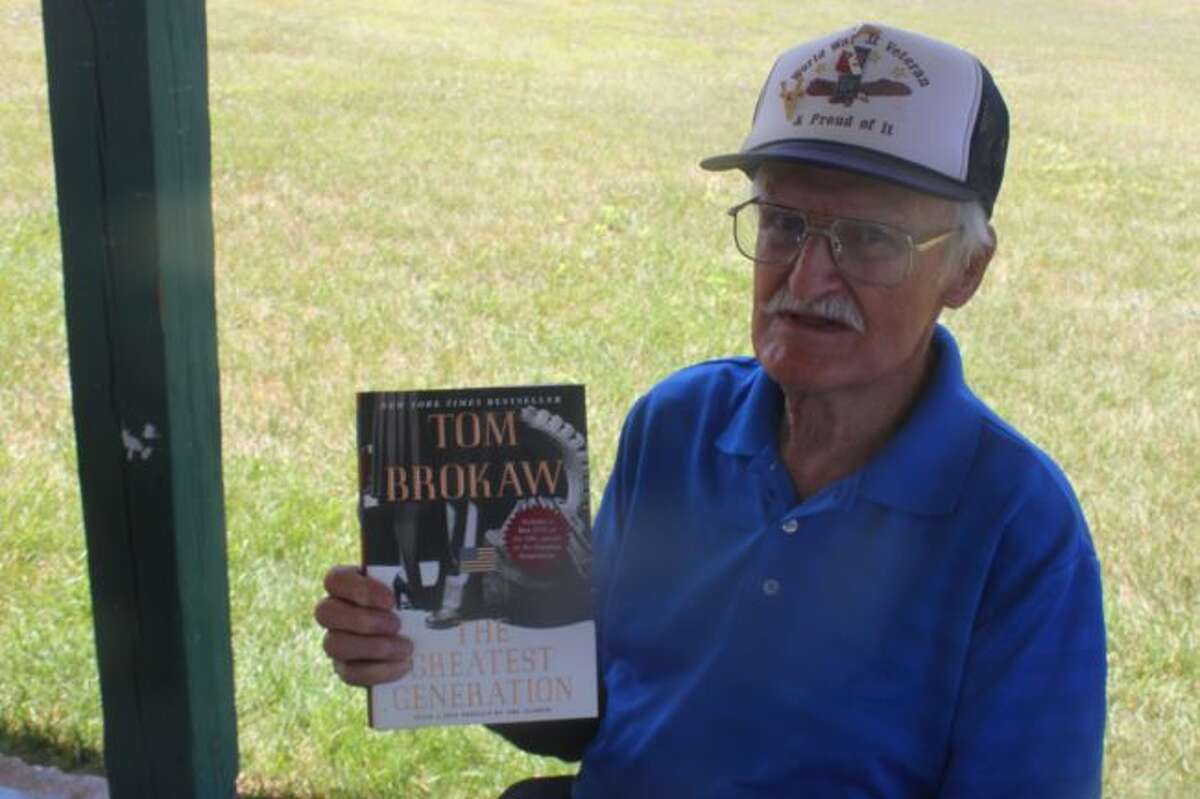 Ralph Grinnell, a World War II vet, and oldest in attendance at 93-years-old, won a door prize, a book called the “Greatest Generation,” one which he is part of.