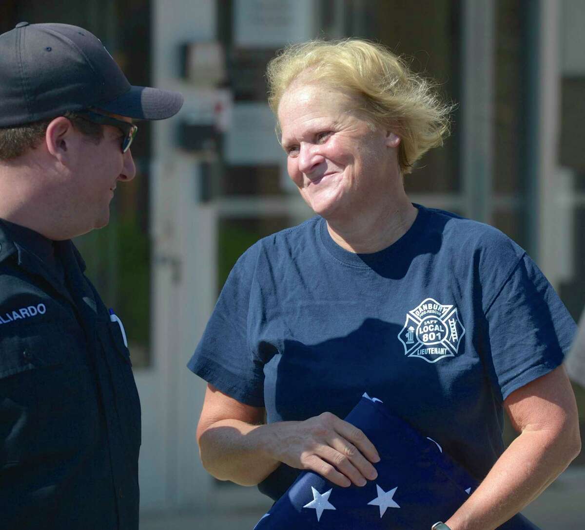 Lieutenant Lorinda Arconti, right, talks with department Communication Coordinator after a flag ceremony to mark her retirement after 32 years with the Danbury Fire Department on Thursday. Arconti was the first female firefighter and the first female Lieutenant.