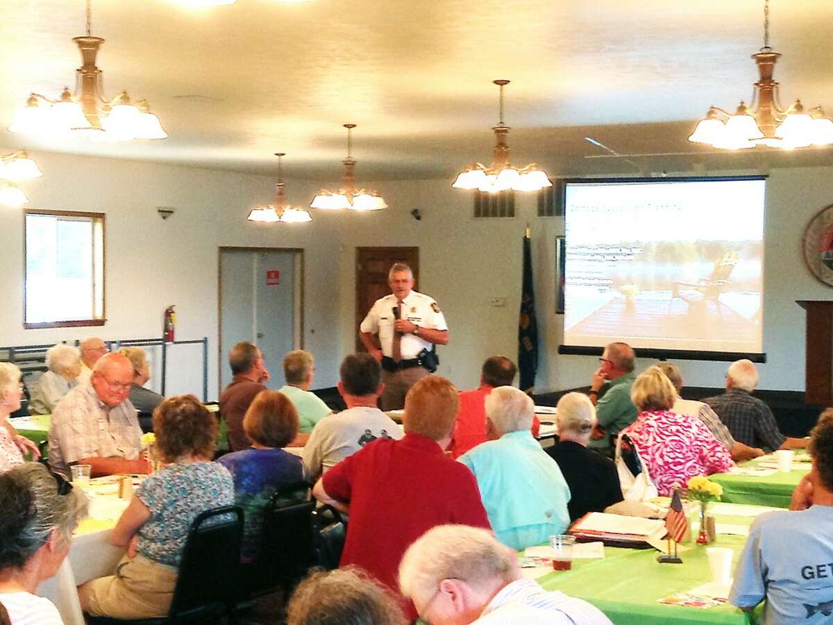 COMING TOGETHER: Lake County Undersheriff Dennis Robinson spoke to more than 70 members of the Lake County Riverside Property Owners Association on Saturday about the county’s 911 system and seasonal ownership. Author David Fry also spoke at the association’s annual luncheon. (Courtesy photo)