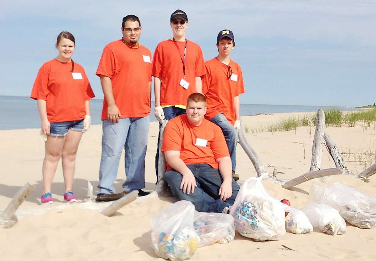 Summer projects: Left to right, Ashley Bratschi, Scott Hernandez, Ron Tyndall, Matt North & Gage Warner (seated) particiaped in a beach clean-up project, organised through the West Shore ESD. (Courtesy photo)