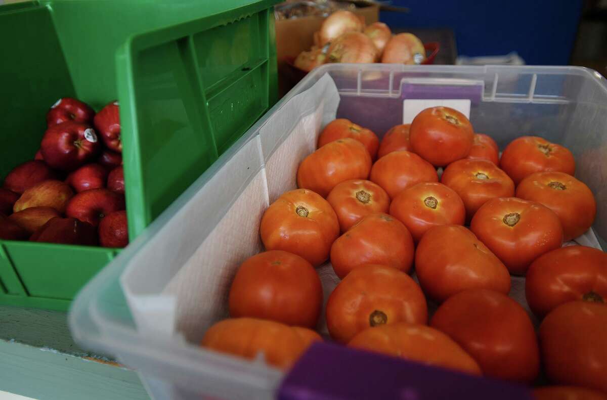 Washington apples, from the Connecticut Food Bank, and fresh tomatoes from a local farm, at the WHEAT food bank in West Haven.