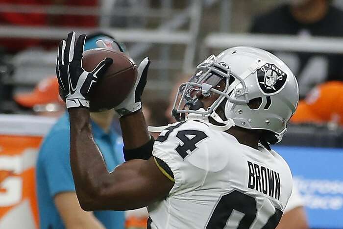 Oakland Raiders' Antonio Brown trains with certified helmet