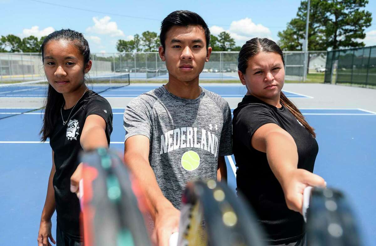 From left to right Megan Do, Brandon Do and Jayci Wong poses for a photo at the Nederland High School tennis courts Wednesday. The players are heading to College Station Photo taken on Wednesday, 05/15/19. Ryan Welch/The Enterprise