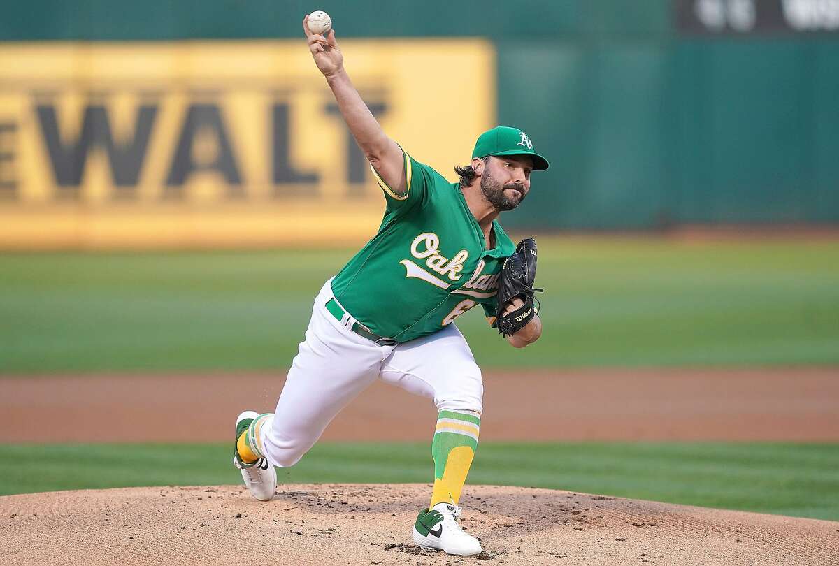 OAKLAND, CA - AUGUST 16: Tanner Roark #60 of the Oakland Athletics pitches against the Houston Astros in the top of the first inning at Ring Central Coliseum on August 16, 2019 in Oakland, California. (Photo by Thearon W. Henderson/Getty Images)