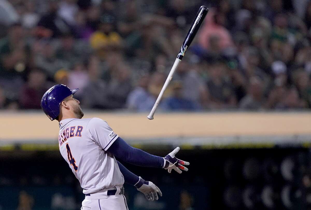 OAKLAND, CA - AUGUST 16: George Springer #4 of the Houston Astros tosses his bat in the air after striking out against the Oakland Athletics in the top of the 10th inning at Ring Central Coliseum on August 16, 2019 in Oakland, California. (Photo by Thearon W. Henderson/Getty Images)