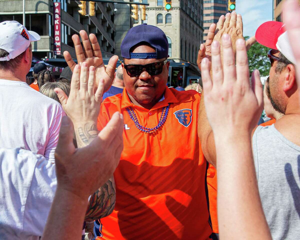 Albany Empire fullback Mykel Benson is greeted by fans during a block party held in front of the Times Union Center on Saturday, Aug. 17, 2019, to celebrate the team’s Arena Bowl win (Jim Franco/Special to the Times Union.)