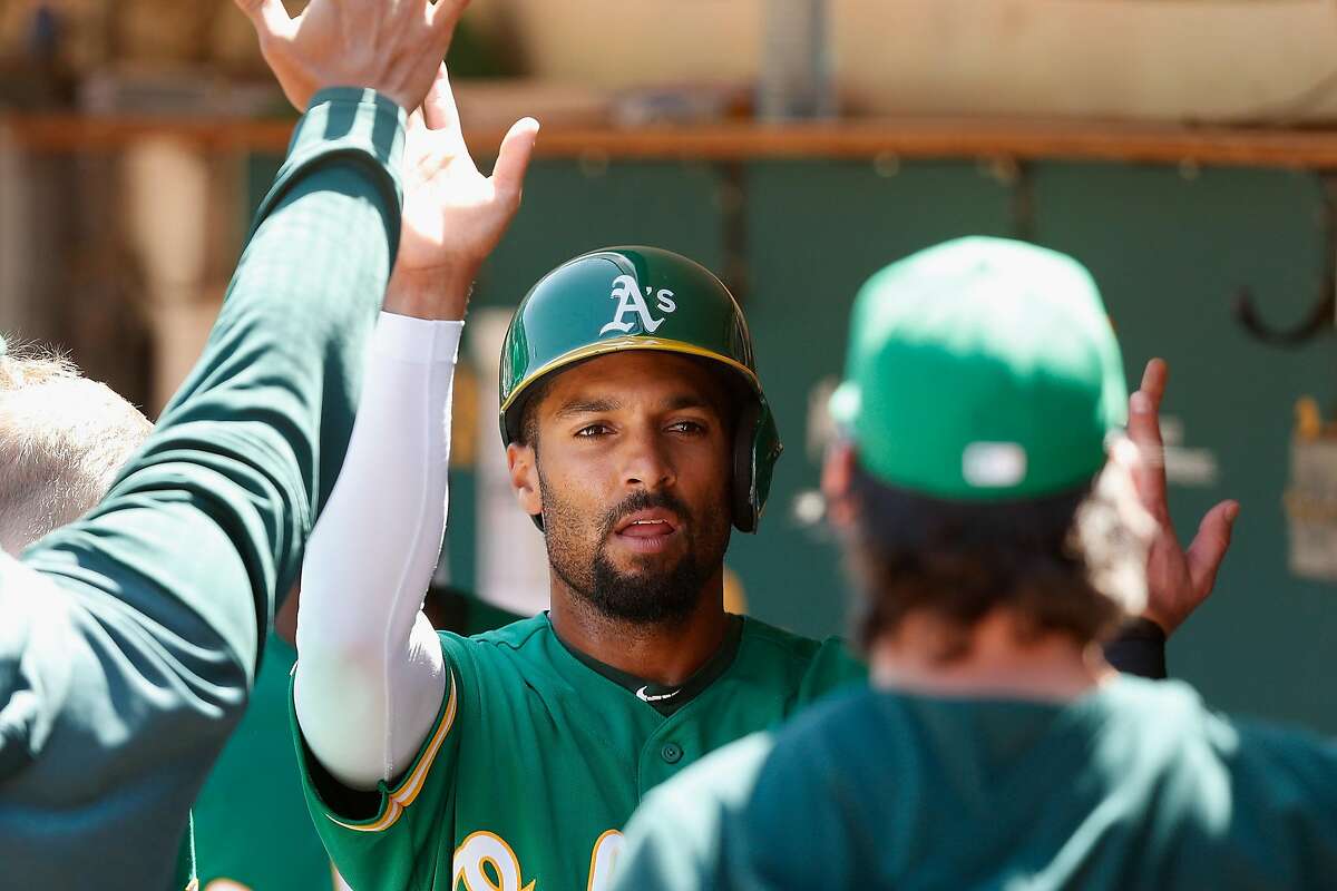 OAKLAND, CALIFORNIA - AUGUST 17: Marcus Semien #10 of the Oakland Athletics celebrates after scoring on a single hit by Matt Olson #28 in the bottom of the third inning against the Houston Astros at Ring Central Coliseum on August 17, 2019 in Oakland, California. (Photo by Lachlan Cunningham/Getty Images)
