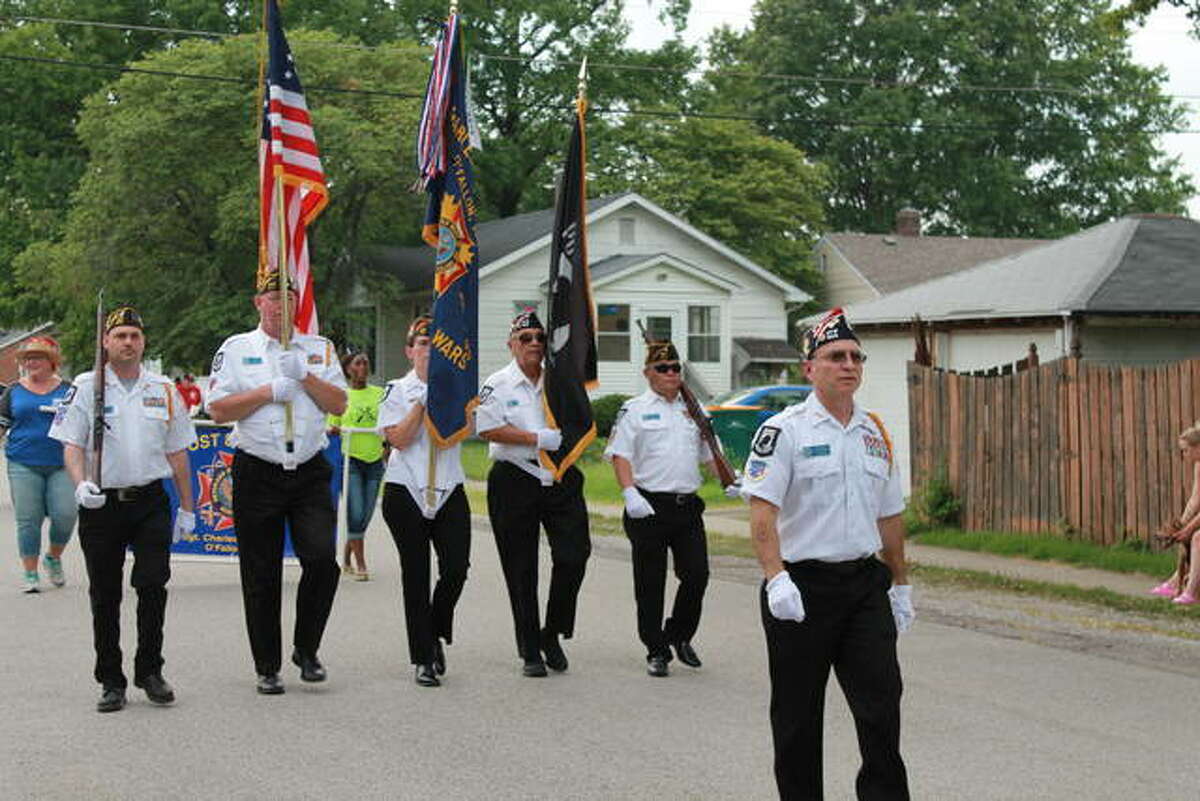 The Veterans of Foreign Wars Post 805 Honor Guard march Saturday during O’Fallon’s 2nd Annual City Fest event.