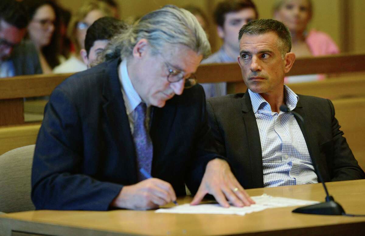 Fotis Dulos, charged with tampering with evidence and hindering prosecution in connection with his wife's disappearance, appears in Stamford Superior Court with his attorney Norm Pattis, left, Friday, Aug. 9, 2018, in Stamford.