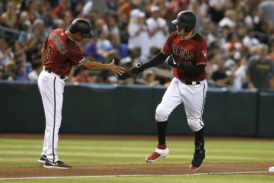 Arizona Diamondbacks' Wilmer Flores, right, celebrates with Tony Perezchica (3) after hitting a solo home run against the San Francisco Giants in the fifth inning of a baseball game, Sunday, Aug. 18, 2019, in Phoenix. (AP Photo/Rick Scuteri) Photo: Rick Scuteri, Associated Press