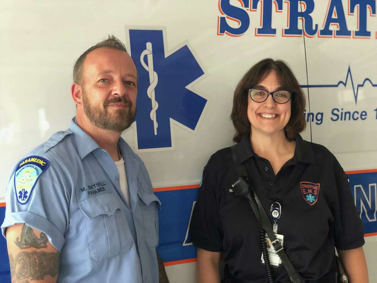 Paramedic Mike Battistelli and emergency medical technician Michelle Edler from Stratford EMS helped a man suffering from heat stroke on a Short Beach ball field on Sunday.