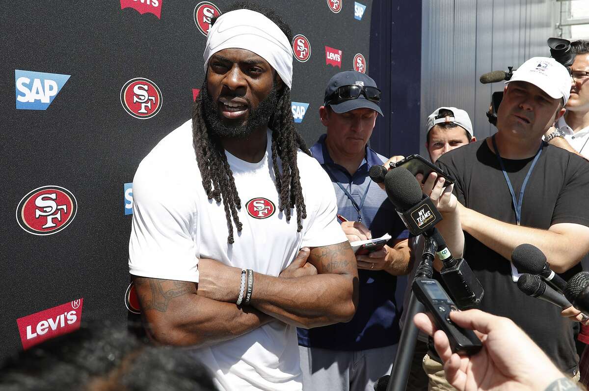 San Francisco 49ers cornerback Richard Sherman talks to reporters after a combined NFL football training camp with the Denver Broncos at the Broncos' headquarters Friday, Aug. 16, 2019, in Englewood, Colo. (AP Photo/David Zalubowski)