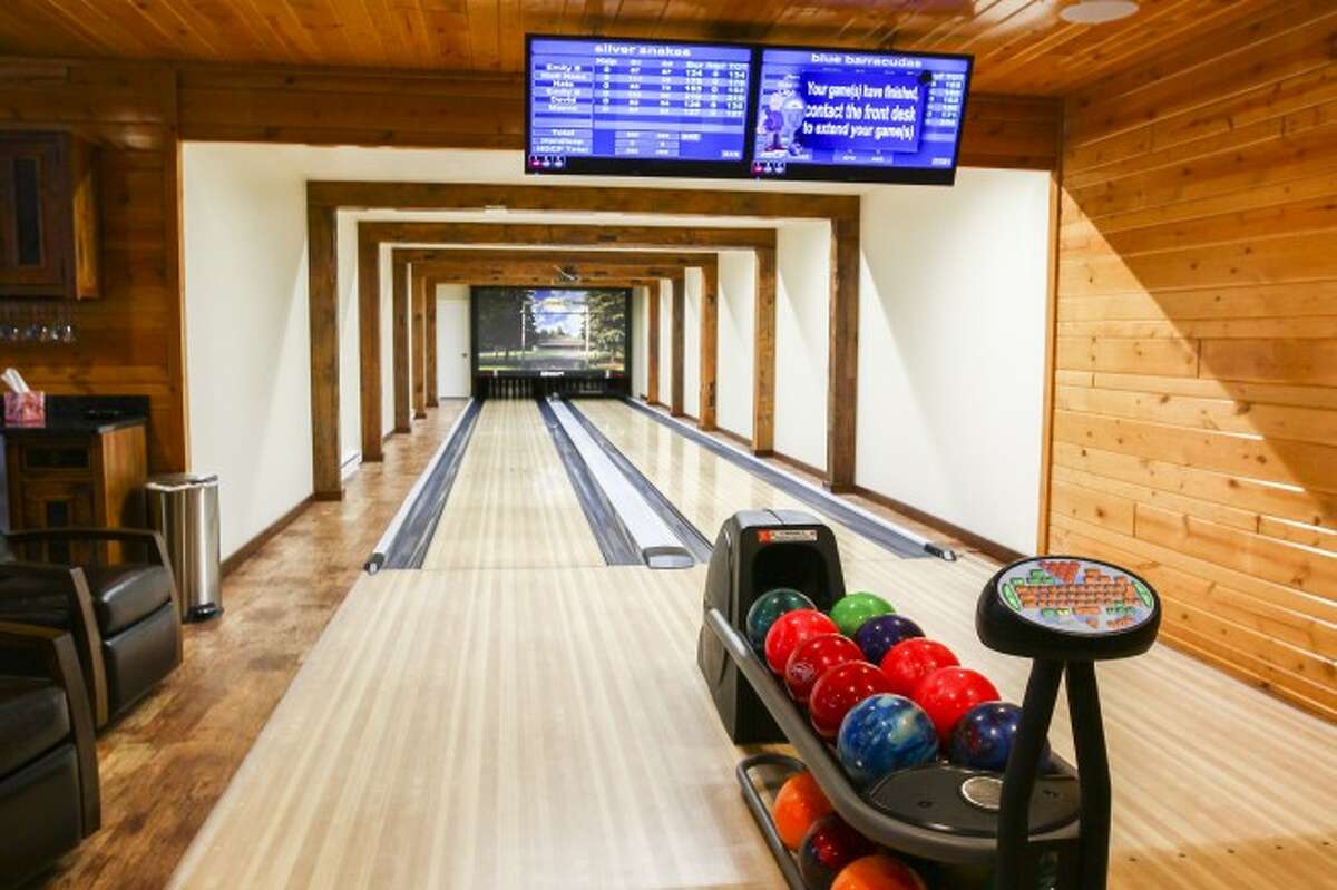 ENTERTAINMENT FOR ALL: The building dubbed "The Lanes," features two bowling lanes fully stocked with bowling balls and shoes, perfect for an evening of fun. The house also features luxurious bedrooms, bathrooms, bar, a large living room, kitchen and gymnasium.