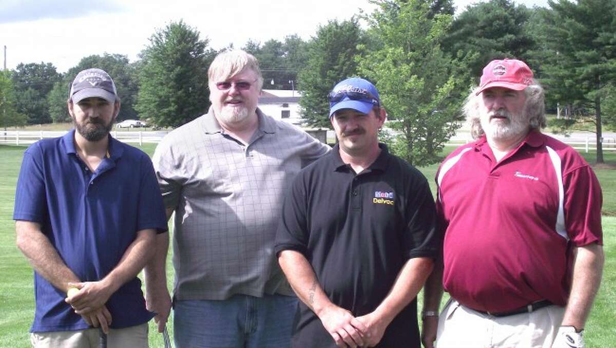 WINNERS: The Big “K” Construction team of John Larr, Kenner McKie, John Sobaski and Phil McKie were the winners of last year’s Golf for Warmth event.