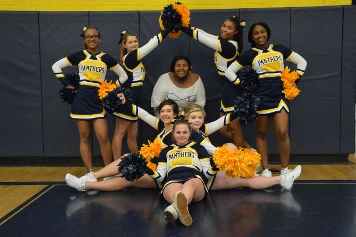 CHEER SQUAD: Back row left to right: Jayna Hawkins, Isabella Hibma, Giovanni Kennedy-Burrell, Nia Freeman. Front row left to right: Madison Simpson, Natalie Abbott, Drew Dykhuis. Center: Coach Heather Bragington