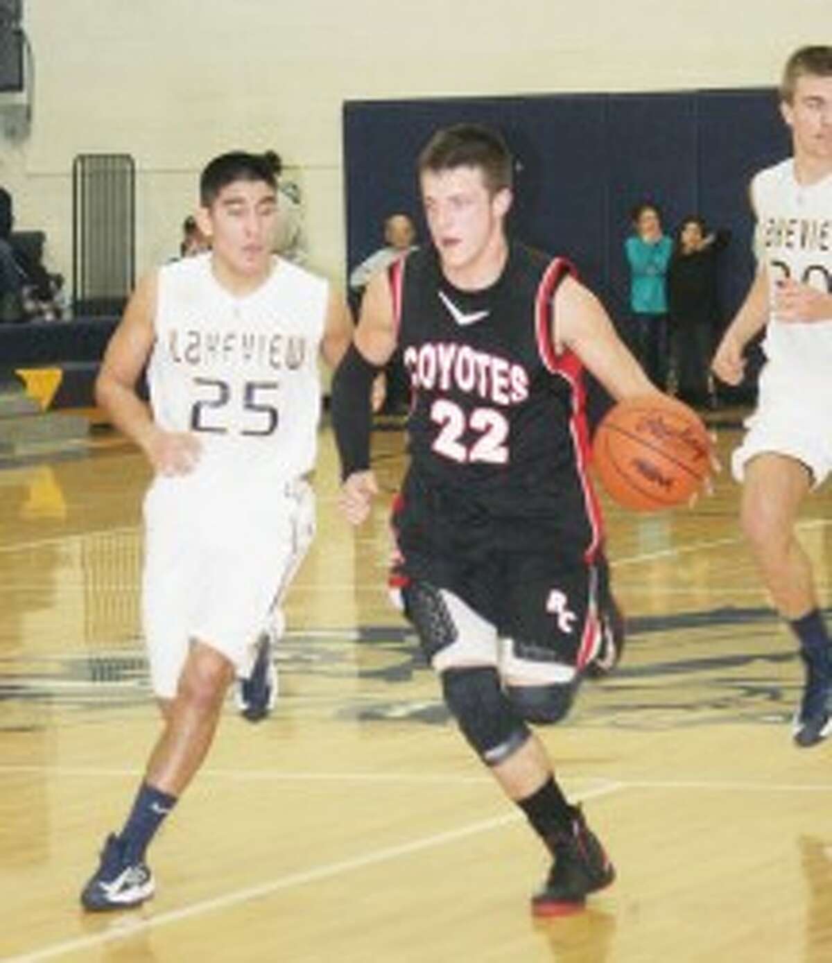 TO THE RIM: Reed City's Kyle Wright drives to the basket against Lakeview in boys basketball action Monday. (Pioneer photo/John Raffel)