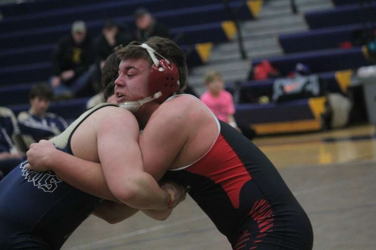 Brett Walker (right) is among Reed City's top wrestlers.