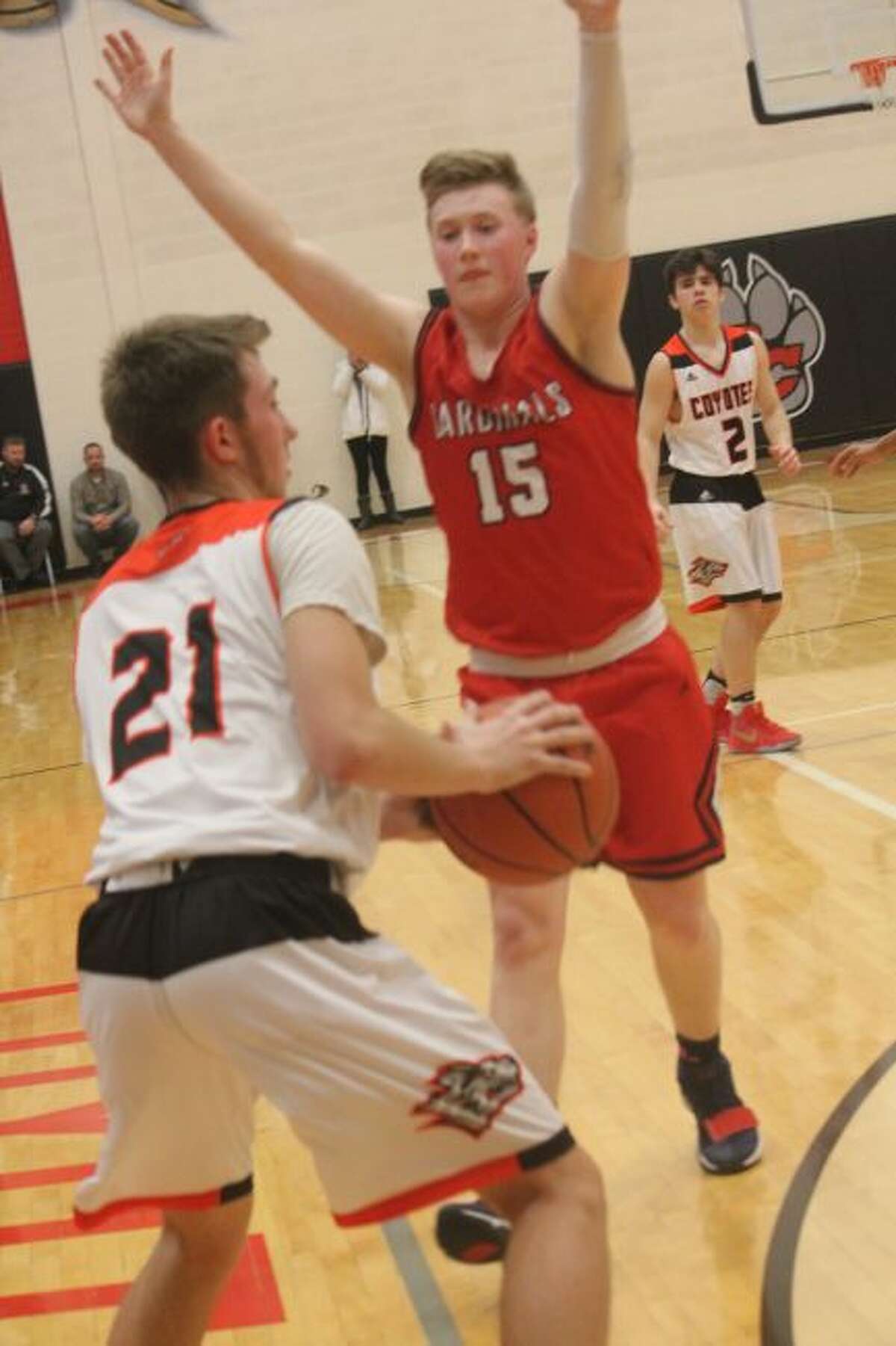 Cody Kailing (21) faces defense from Big Rapids' Jackson Lund.
