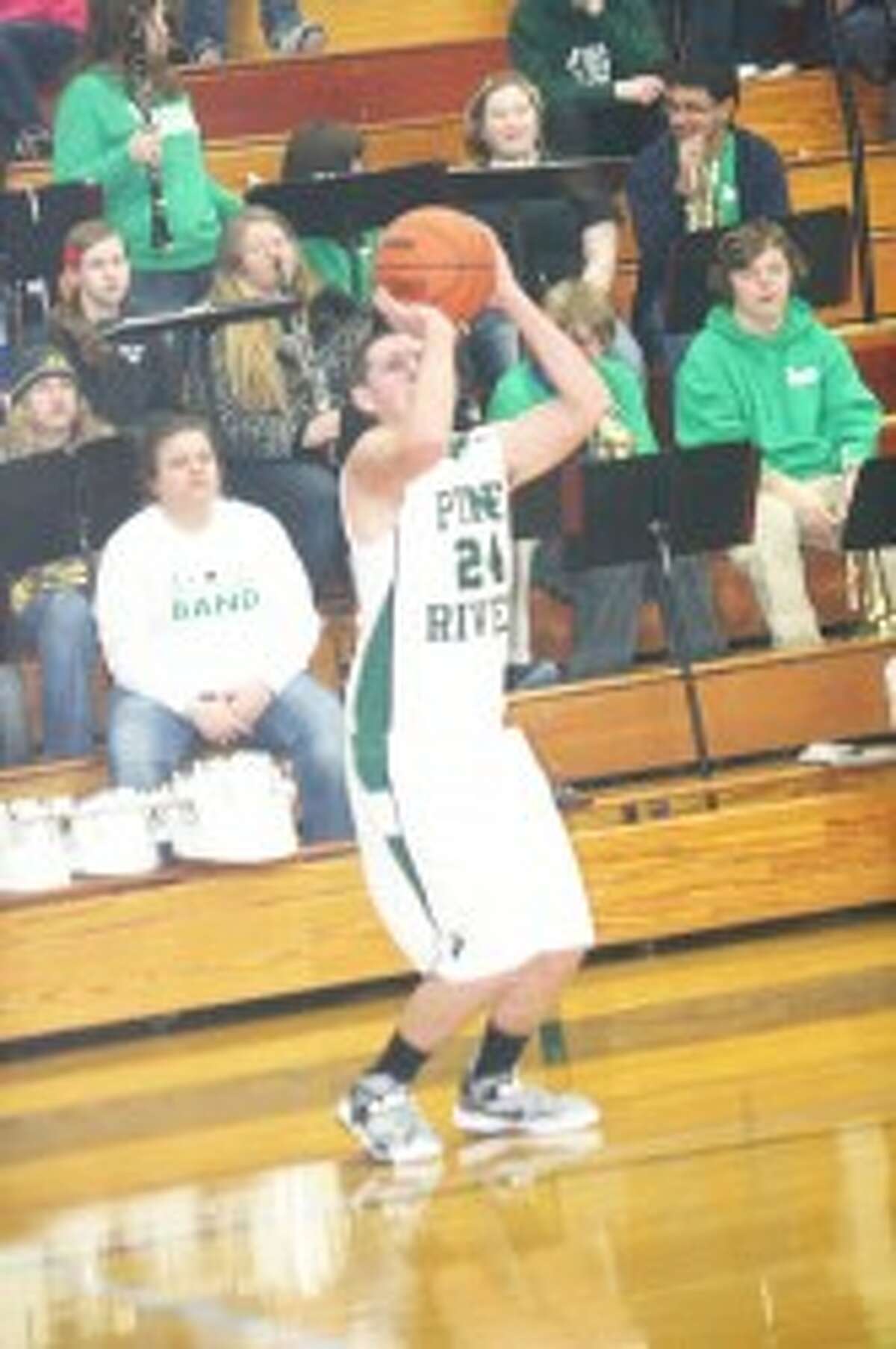 First loss: Tyler Lewis (24) takes a shot for Pine River. (Herald photo/John raffel)