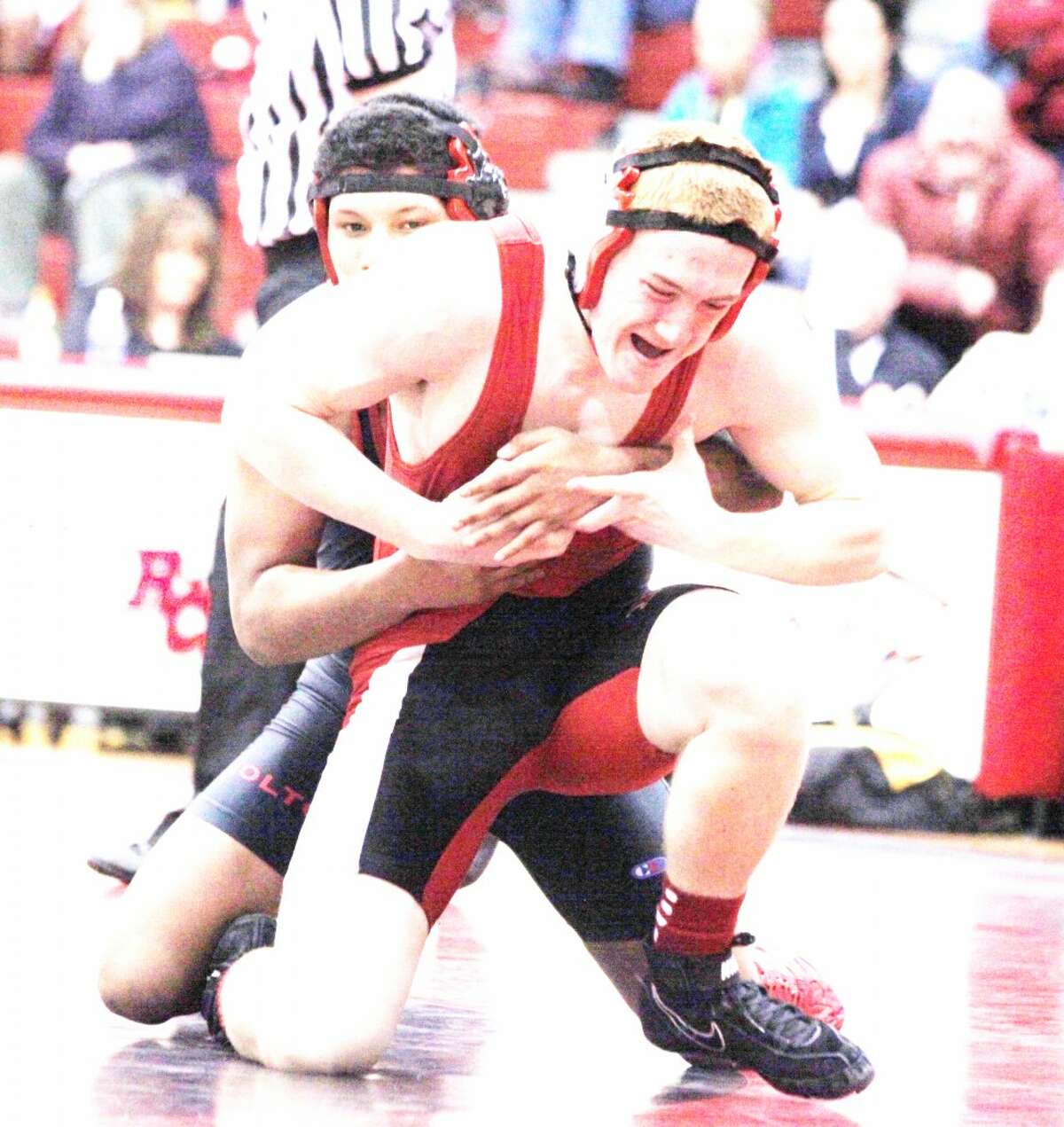 Leverage: Johnathan Green looks to get leverage against Holton on Wednesday. (Pioneer photo/Martin Slagter)