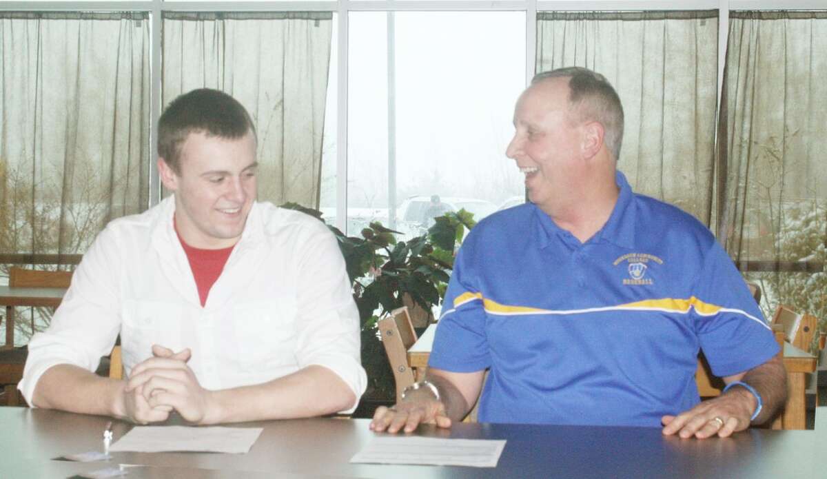 Ready for the future: Devin Ruppert (left) shares a lighter moment with Muskegon Community College coach Cap Pohlman.