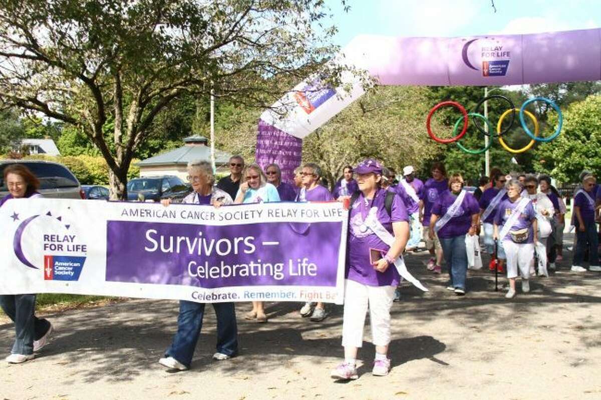 Cancer survivors begin the 2016 Relay for Life in Mecosta County's Hemlock Park. The 2018 walk is set to begin at 6 p.m. on Friday, March 23, at Ferris State University's Wink Arena. (Herald Review file photo)