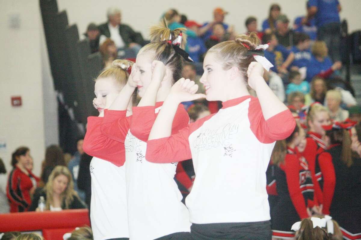 CHEER: Reed City and Evart cheerleaders performed at Saturday's Chippewa Hills Invitational. (Herald Review photos/John Raffel)