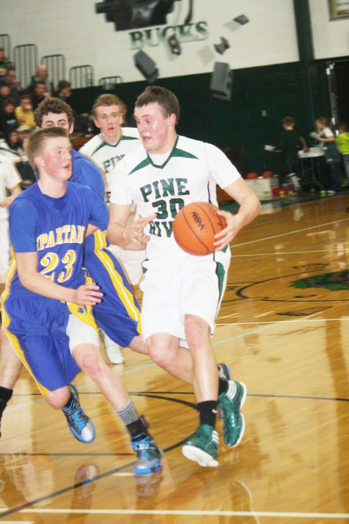 REBOUND WIN: Pine River's Devin Ruppert drives to the basket against Mason County Central. (Herald Review photo/John Raffel)