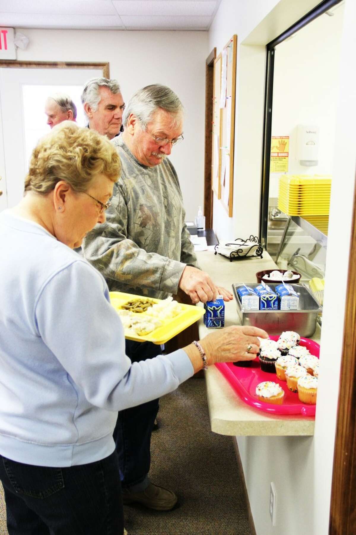 MORE INTERACTION: Staff and seniors are able to interact more with the meals program being held in a local location. (Herald Review photo/Sarah Neubecker)