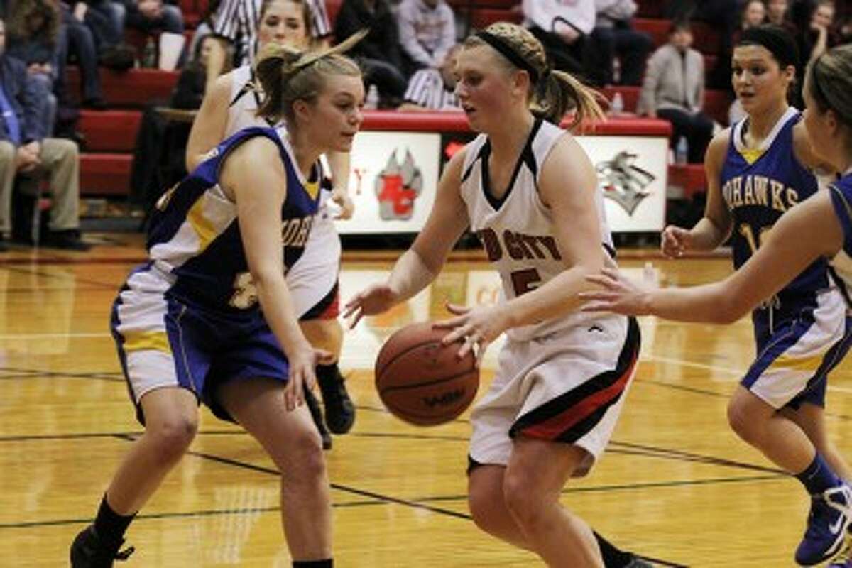 TO THE HOOP: Reed City's Makenzie Switzer take the ball to the basket on Wednesday against Morley Stanwood. (Pioneer photo/Martin Slagter)