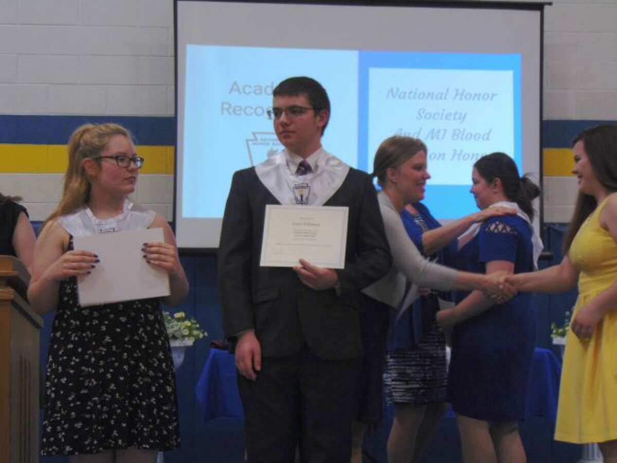 Evart High School seniors received their National Honor Society stoles during their awards night. Students also received various scholarships to help them cover the costs of college. (Herald Review photo/Shanna Avery)