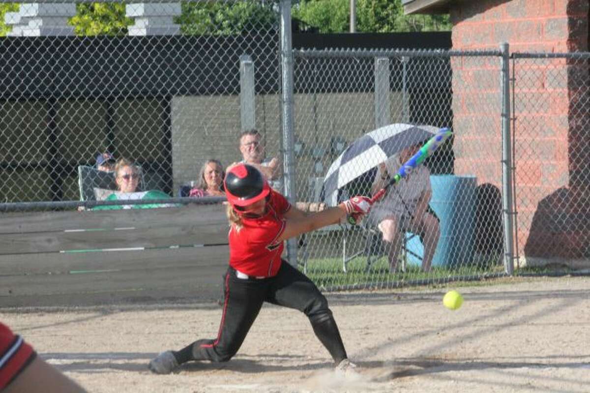 Jordyn Storch fouls off a pitch against Kent City.