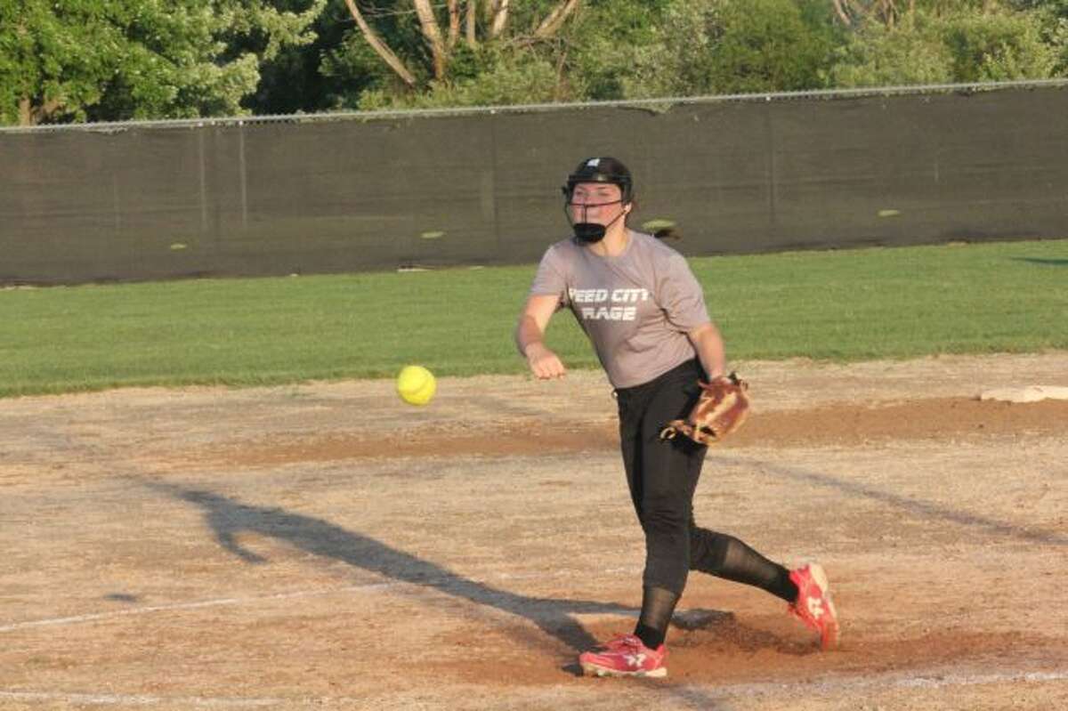 Reed City's Maddie Morgan delivers a pitch/