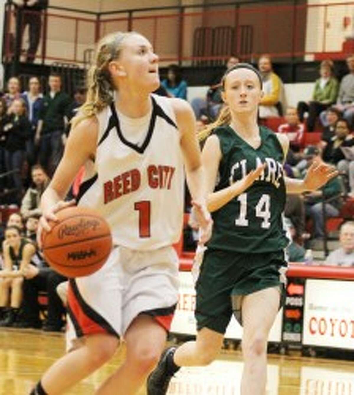 GOING UP: Reed City's Emma Lockhart goes in for a lay-up against Clare in district semifinal action on Wednesday. (Pioneer photo/Martin Slagter)