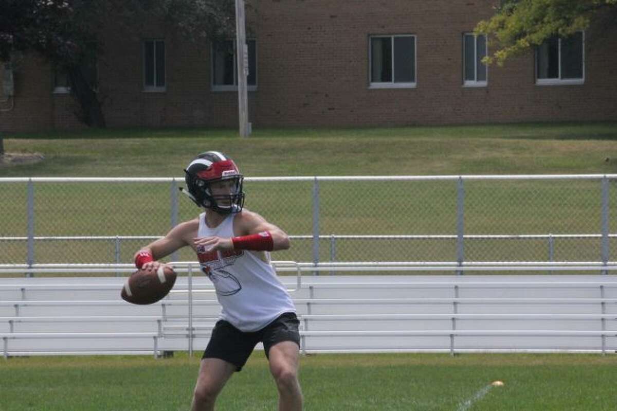 Jackson Price gets set to pass the ball at a Ferris passing camp.