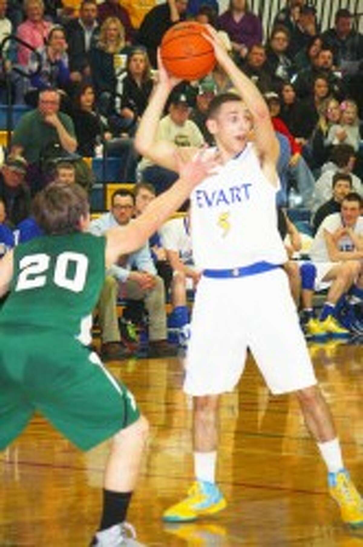 SEASON FINALE: Nate Struble looks to make a pass for Evart against Pine River. (Herald Review/John Raffel)