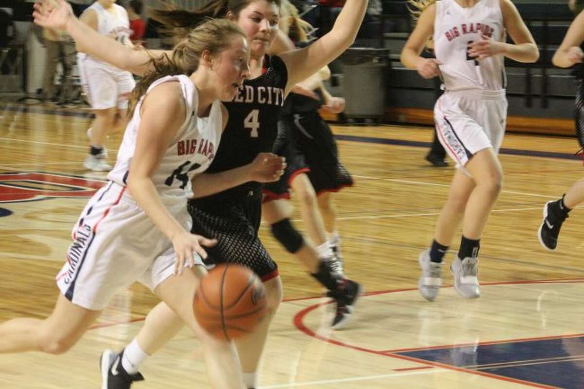 Maddie Morgan (4) plays defense for Reed City/