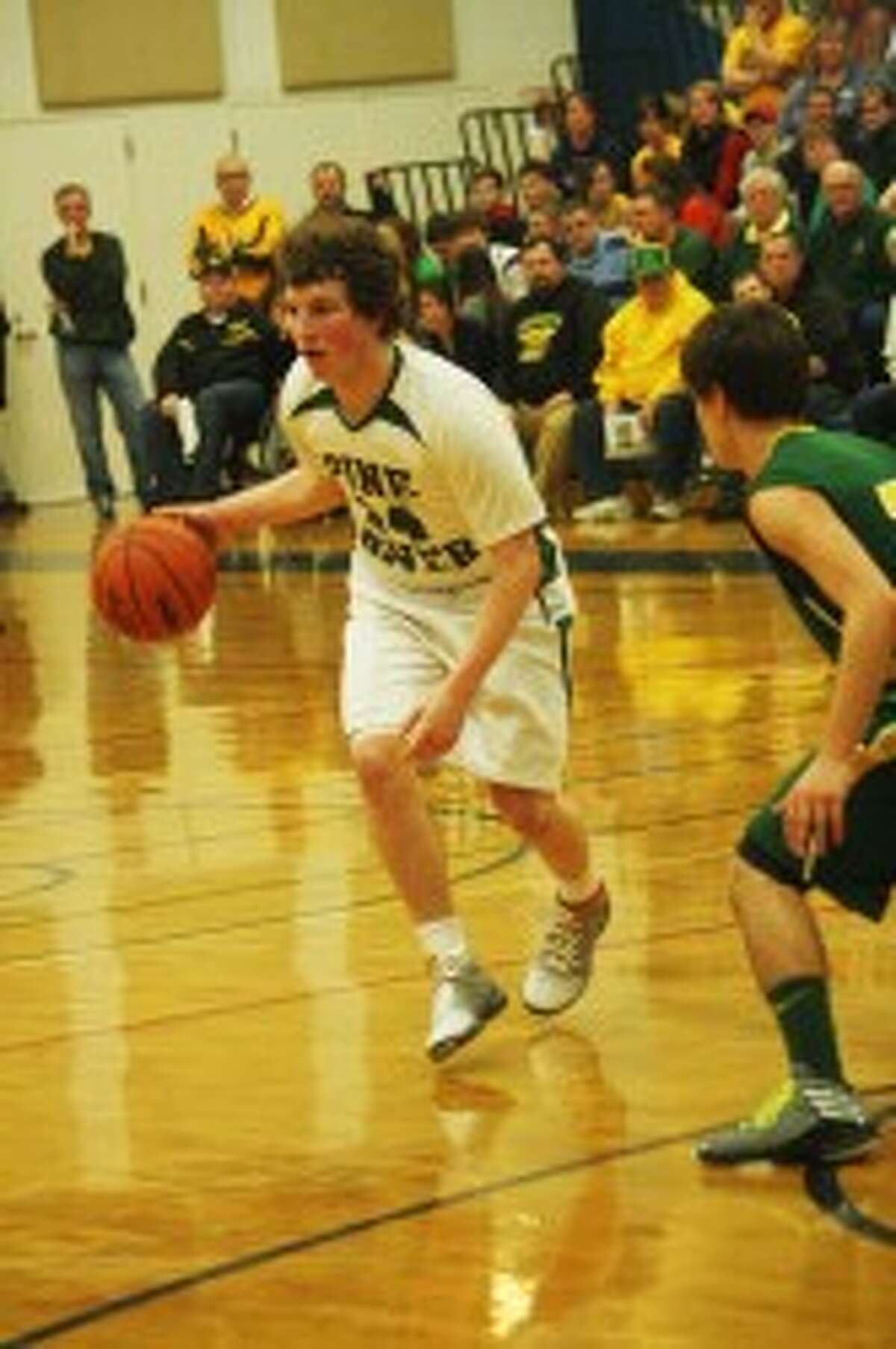 CHAMPS: Mitchell McDonald looks to drive during Friday's district final against McBain. (Pioneer photo/John Raffel)