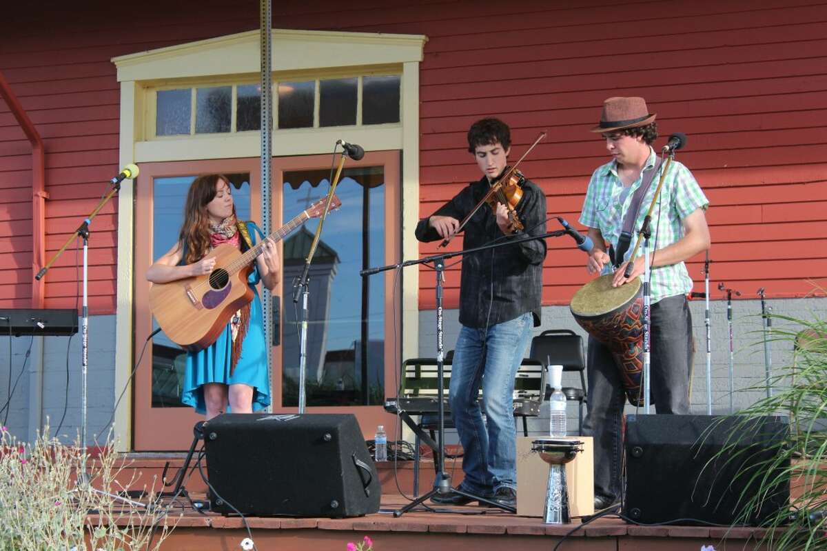 CELTIC FAVORITES: Gasta, a celtic band from Hart, Mich. plays songs and tunes on Saturday at the Evart Depot. Pictured, from left, is Jennifer Versluis on guitar.