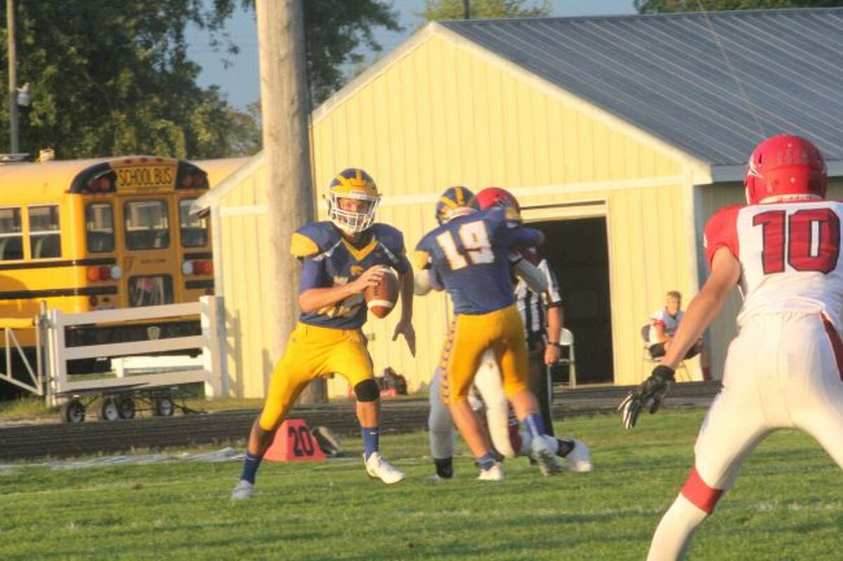 Carter Pritchard looks for a receiver against Holton.