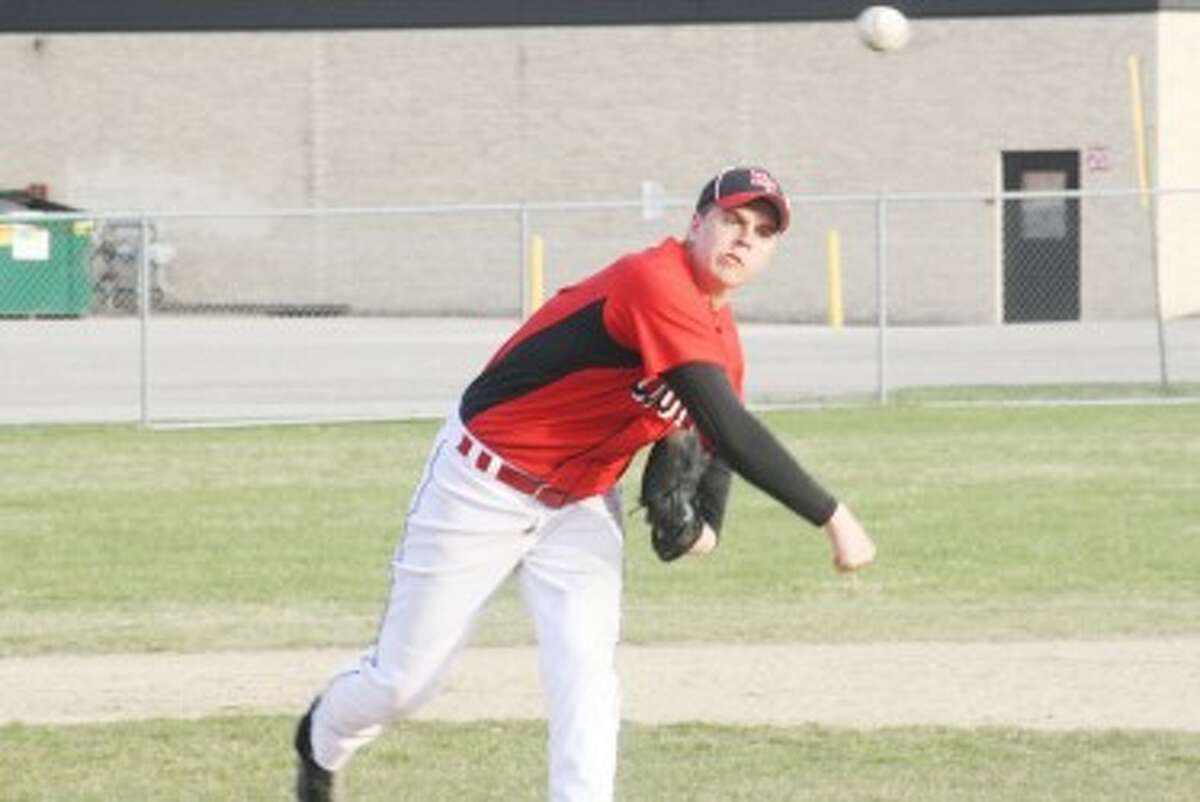 ON THE WAY: Reed City's Ryan Willis fires in a pitch during Friday's action against Lakeview. The coyotes dropped both games of the doubleheader. (Pioneer photo/John Raffel)