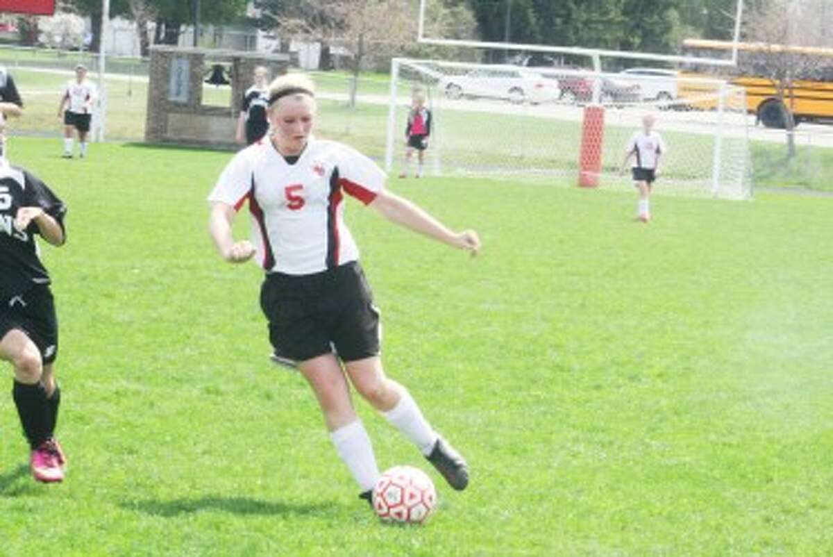 SOCCER: Makenzie Switzer (5) takes the ball down the field for Reed City against Newaygo. (Herald Review Photo/John Raffel)